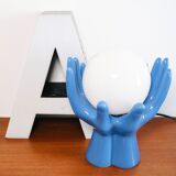 Ceramic lamp hands holding blue globe
