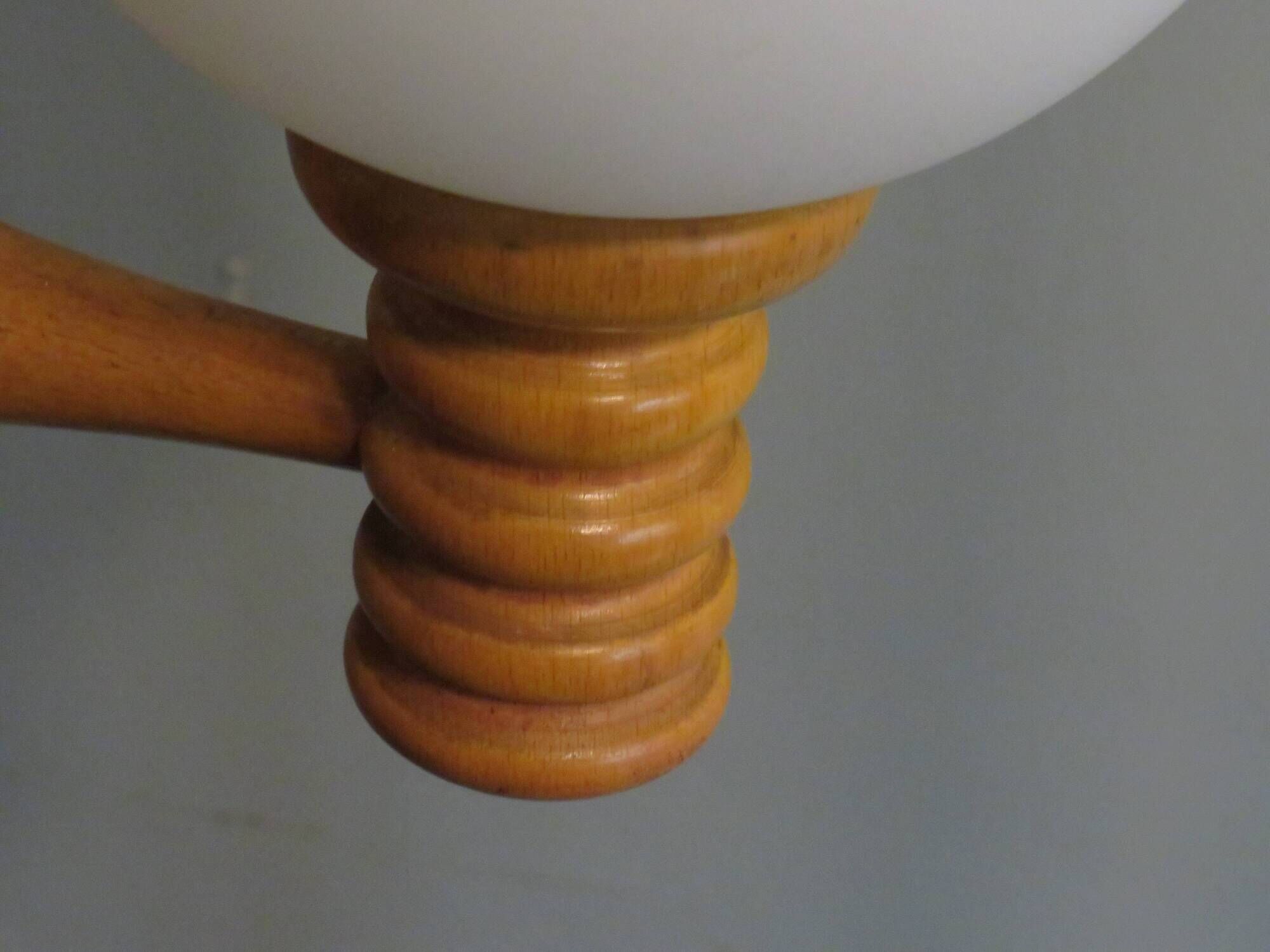 Space age chandelier in 5-arm wood with white frosted opaline glass spheres.