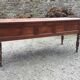 Old farmhouse table with cherry and chestnut panels with 3 drawers.