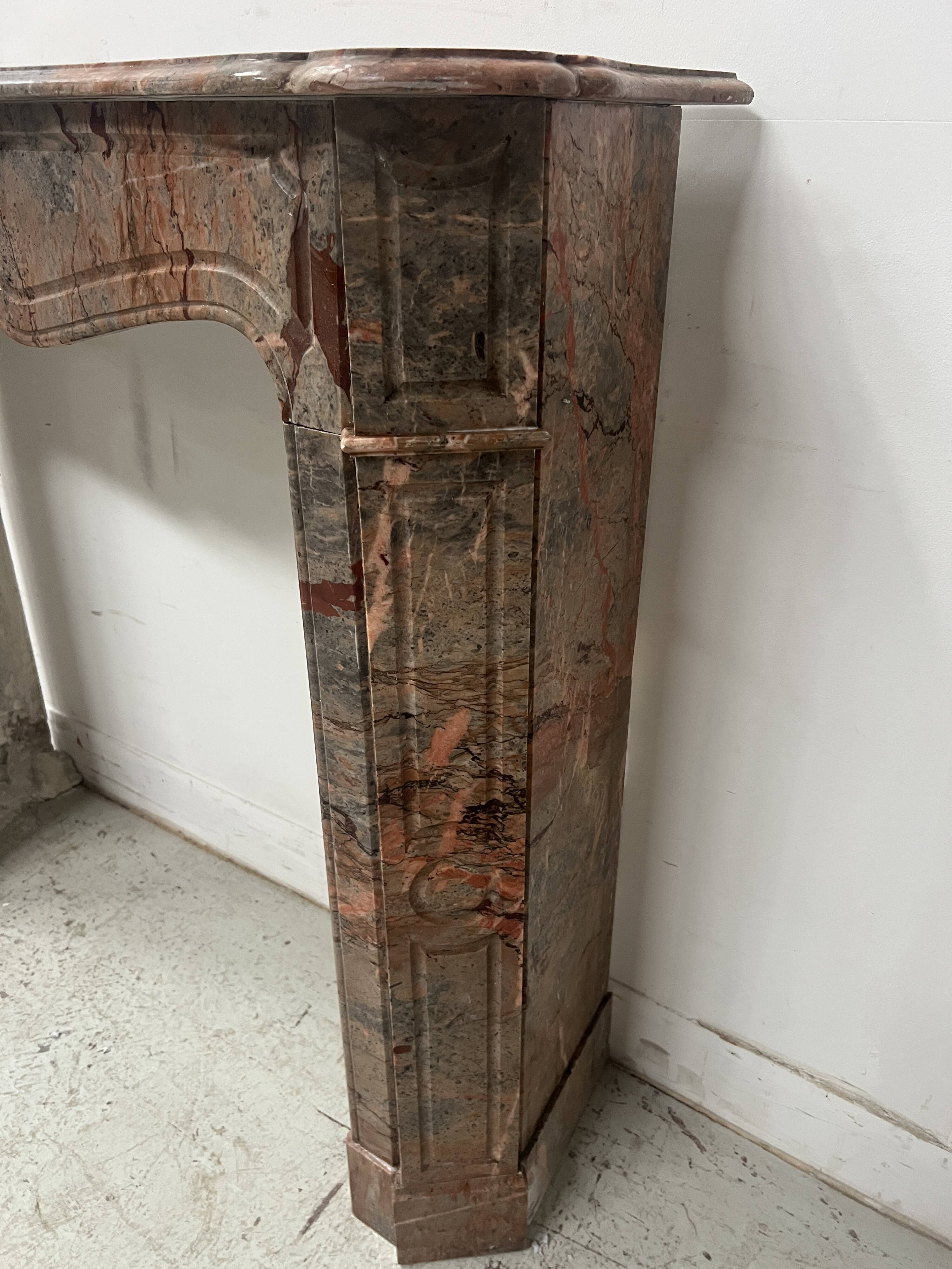 Louis XV style fireplace, "Pompadour" model, grey-pink marble, 20th century