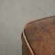 Set of a sheepskin armchair and ottoman finished with matching piping