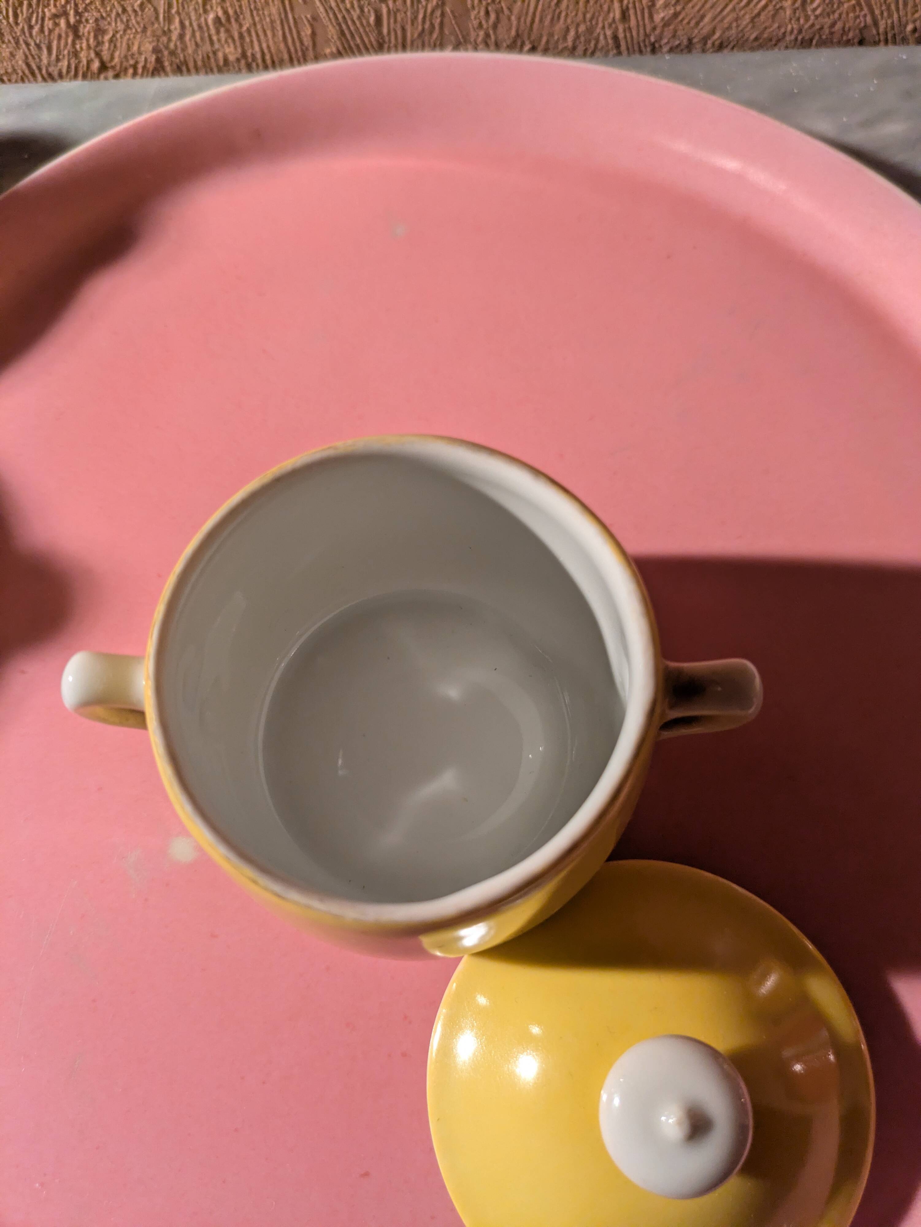 6 small porcelain cream pots from Limoges with a tray.