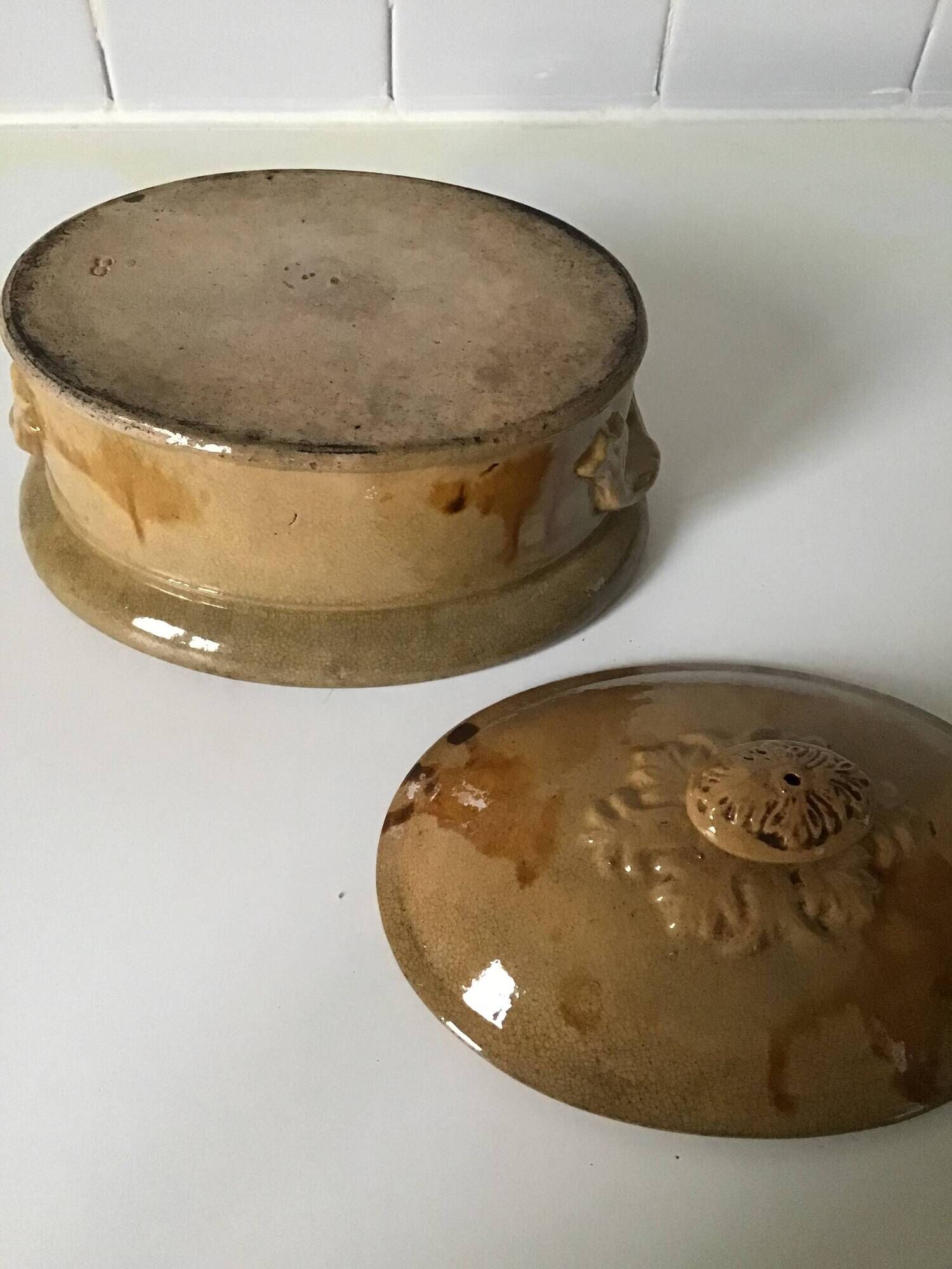 Old terrine of pastry or foie gras in beige glazed earthenware with brown drips. Very beautiful pa