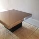 Square pedestal coffee table with mirror top