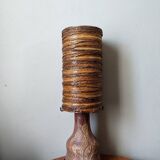 Table lamp with terracotta base and resin shade.