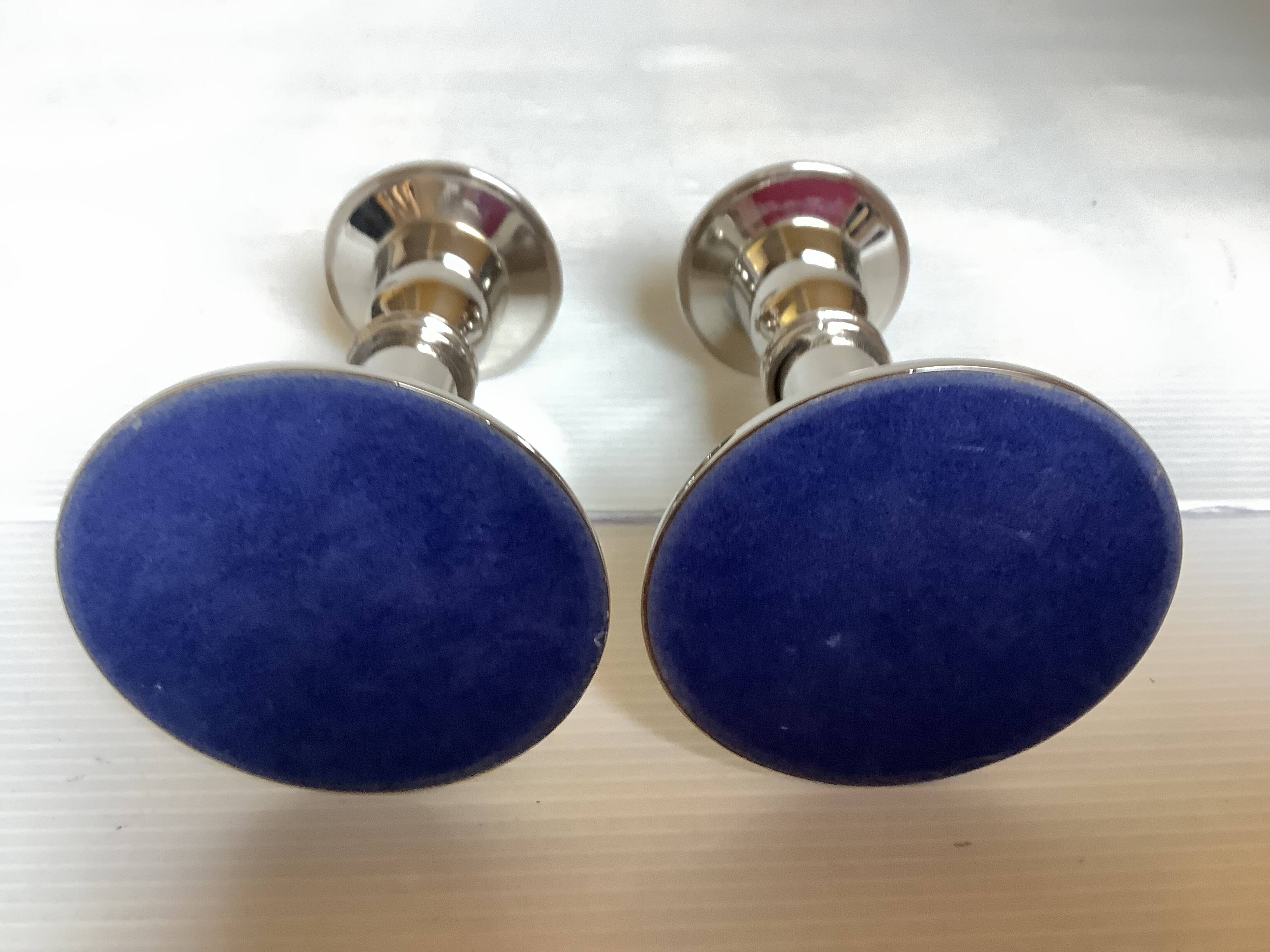 Pair of silver metal candlesticks