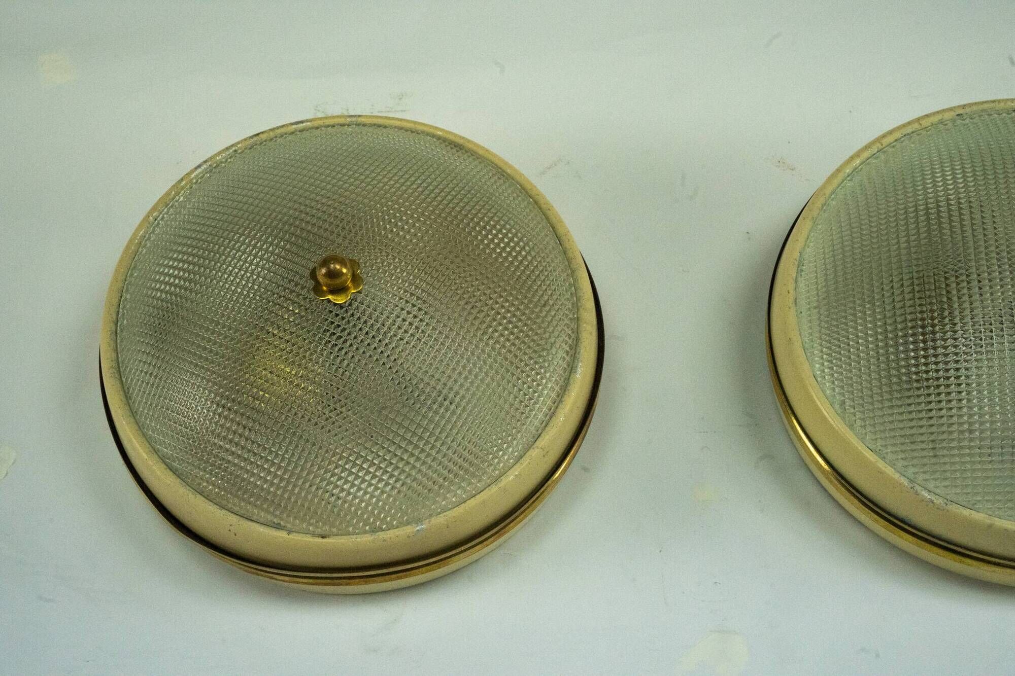 Lumi Milano, pair of wall or ceiling lamps in glass, brass and lacquer, 50s