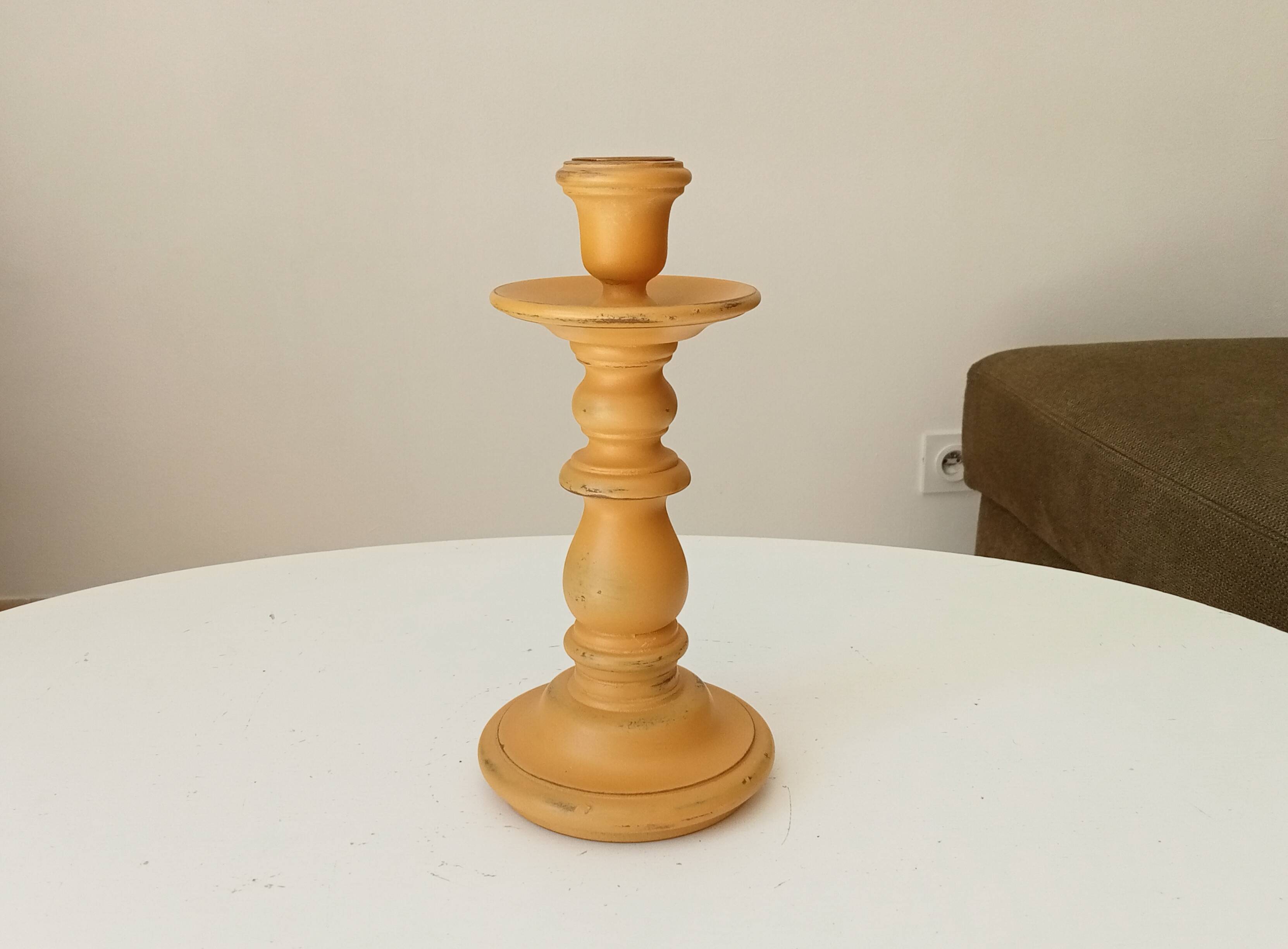 Vintage candle holder in weathered yellow wood