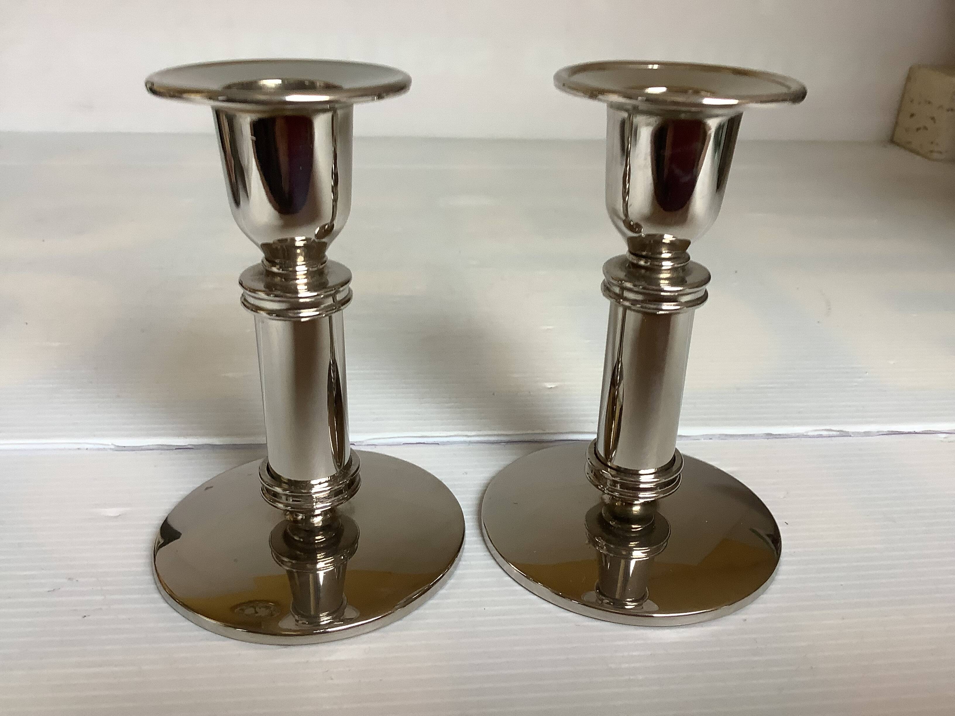 Pair of silver metal candlesticks