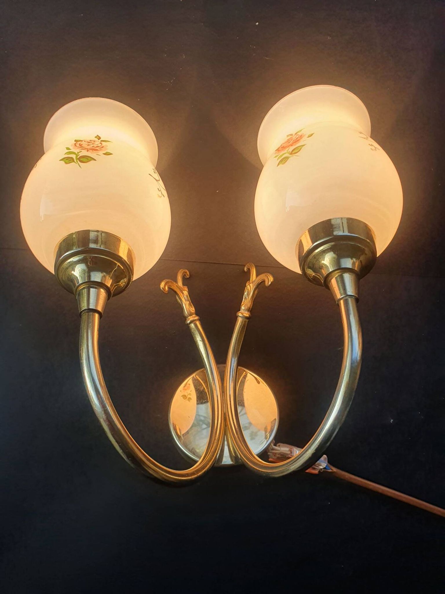 Pair of vintage wall sconces in gilded brass and pink opaline glass.