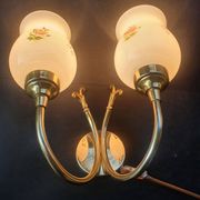 Pair of vintage wall sconces in gilded brass and pink opaline glass.