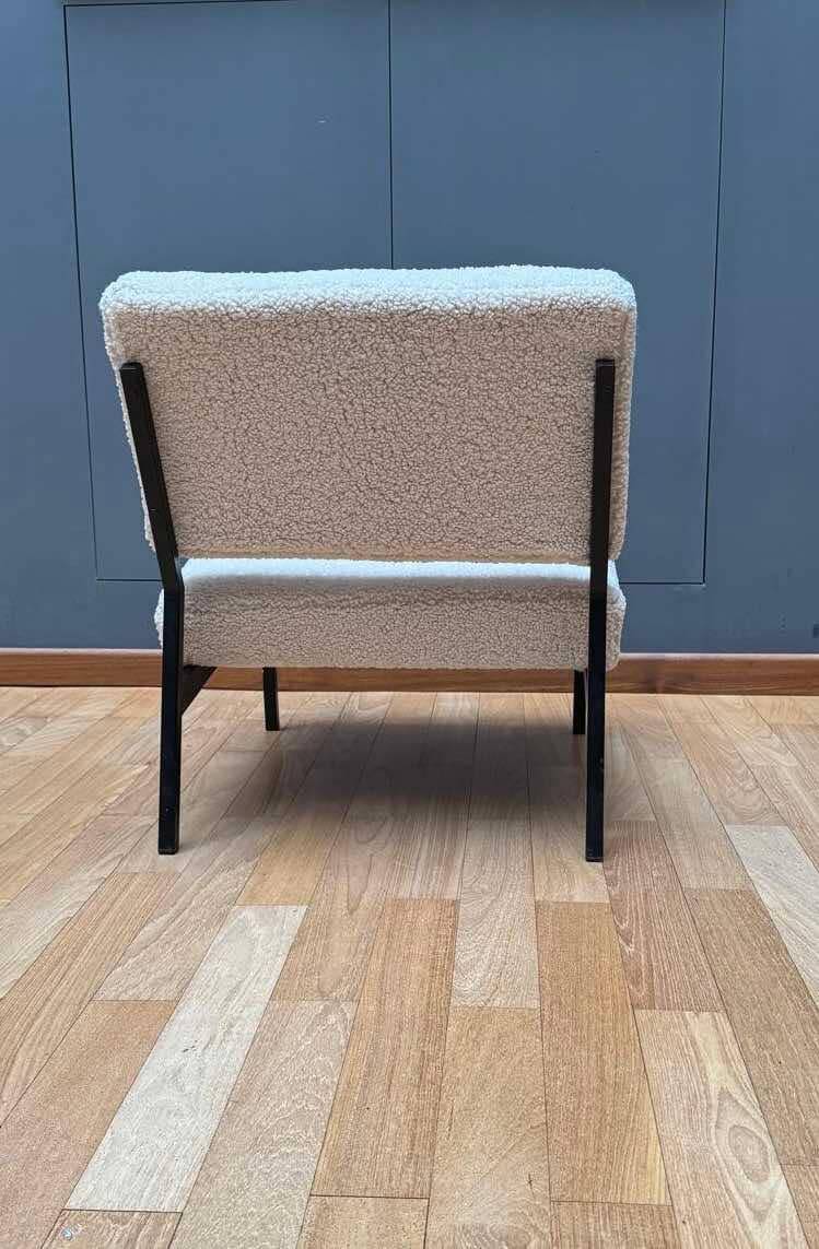 Pair of vintage armchairs, black metal and sheepskin fabric, France 1950.