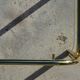Nested tubular tables in gold metal.