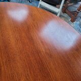 Baumann style round table with integrated extensions from the 70s
