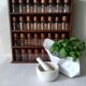 Wooden shelf with 32 vintage Cole & Mason spice jars