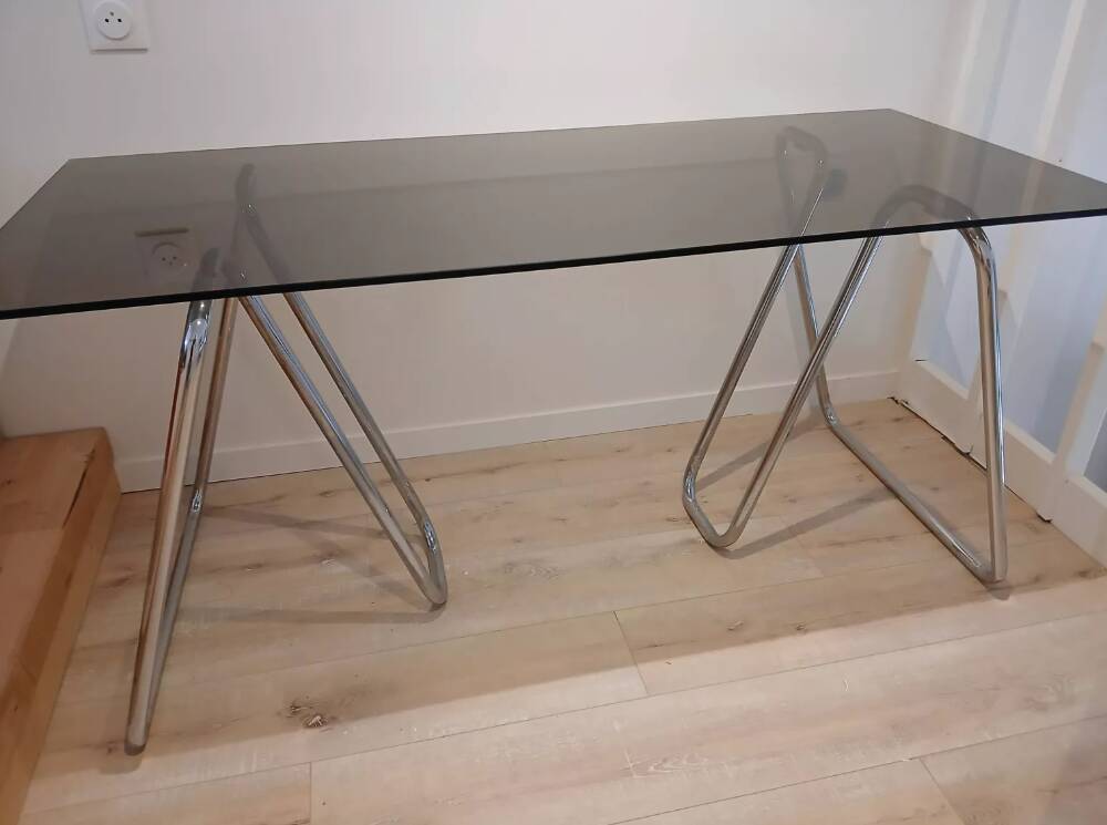 Smoked glass desk on tubular chrome trestles, 1970s design.