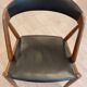 Set of 6 vintage Kai Kristiansen chairs in solid teak and black faux leather.