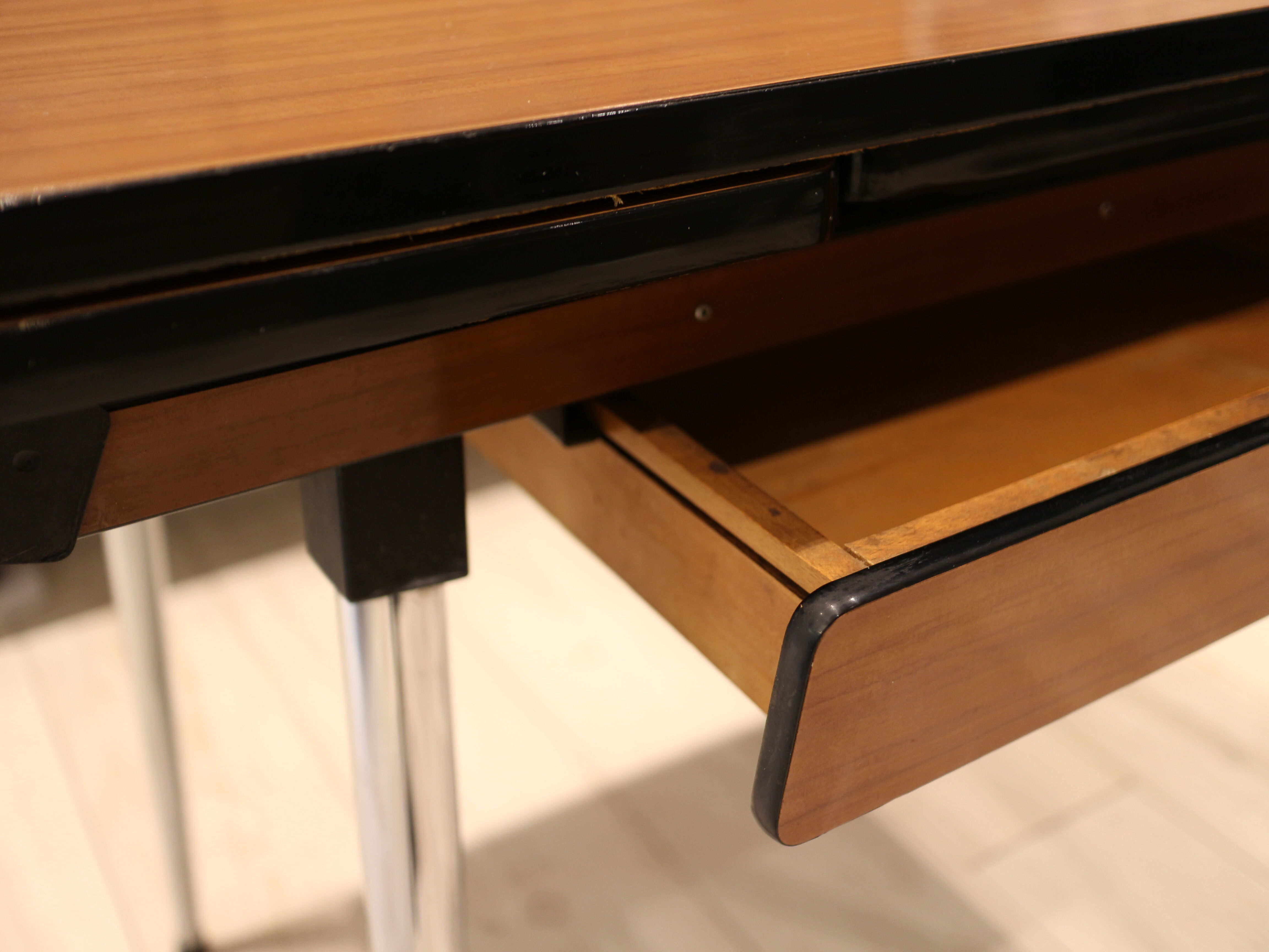 Briwn Formica table with extension cords and drawer