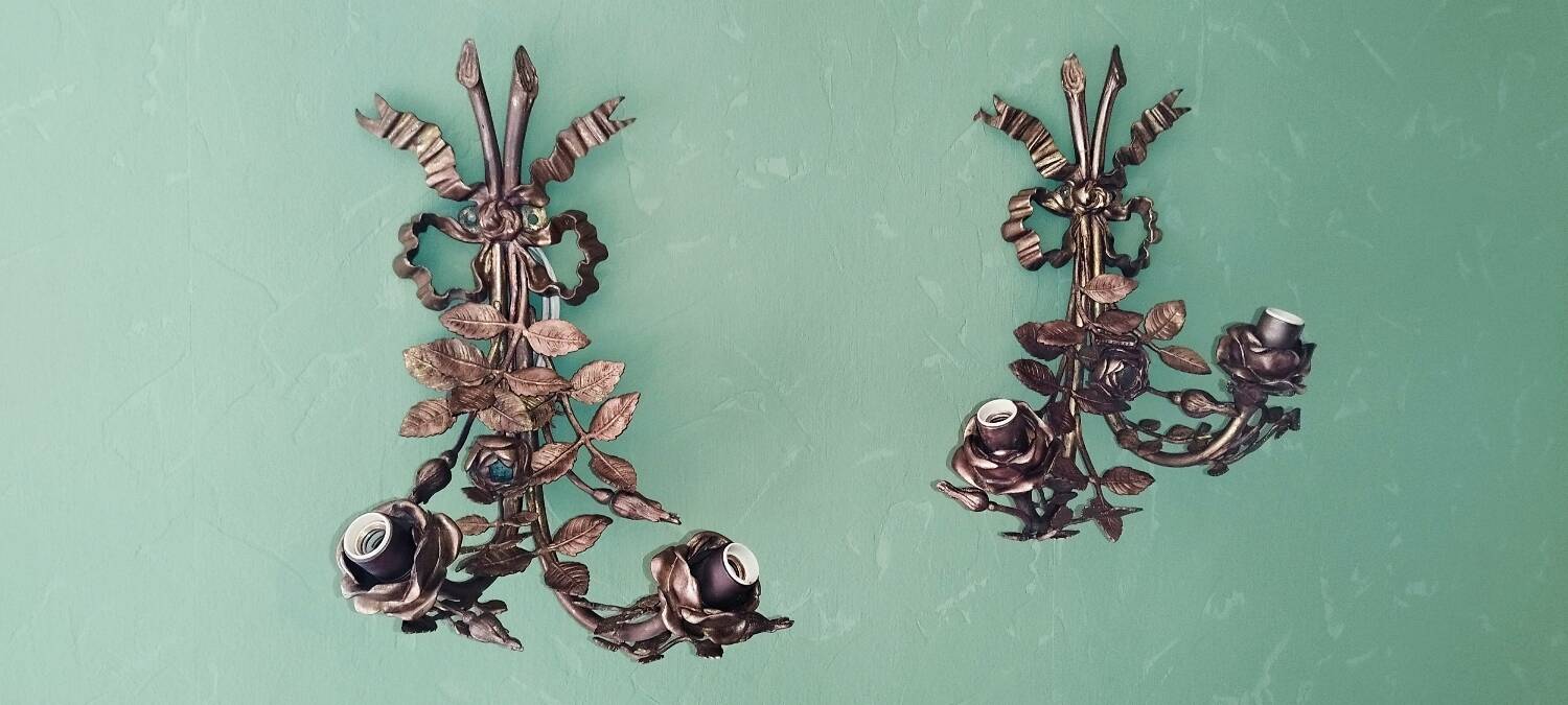 Pair of bronze and gilded metal wall sconces in the Louis XVI style.
