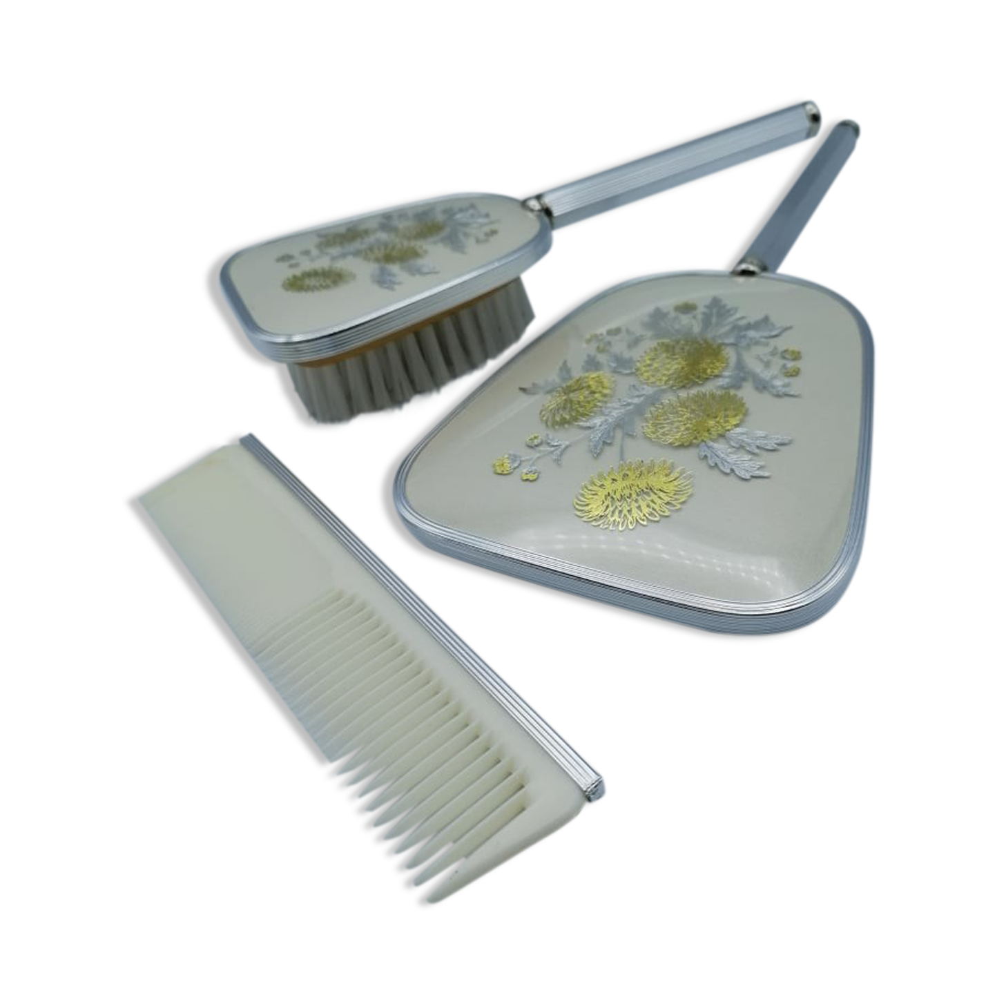 Hand mirror assembly, comb and brush.