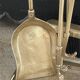 Brass fireplace tools in the style of Maison Baguès.