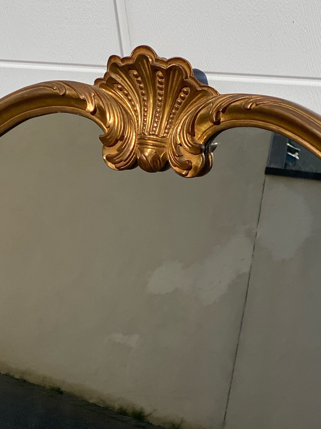 Turned champ-shaped mirror