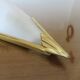 Art Deco wall light in brass and thick frosted glass.
