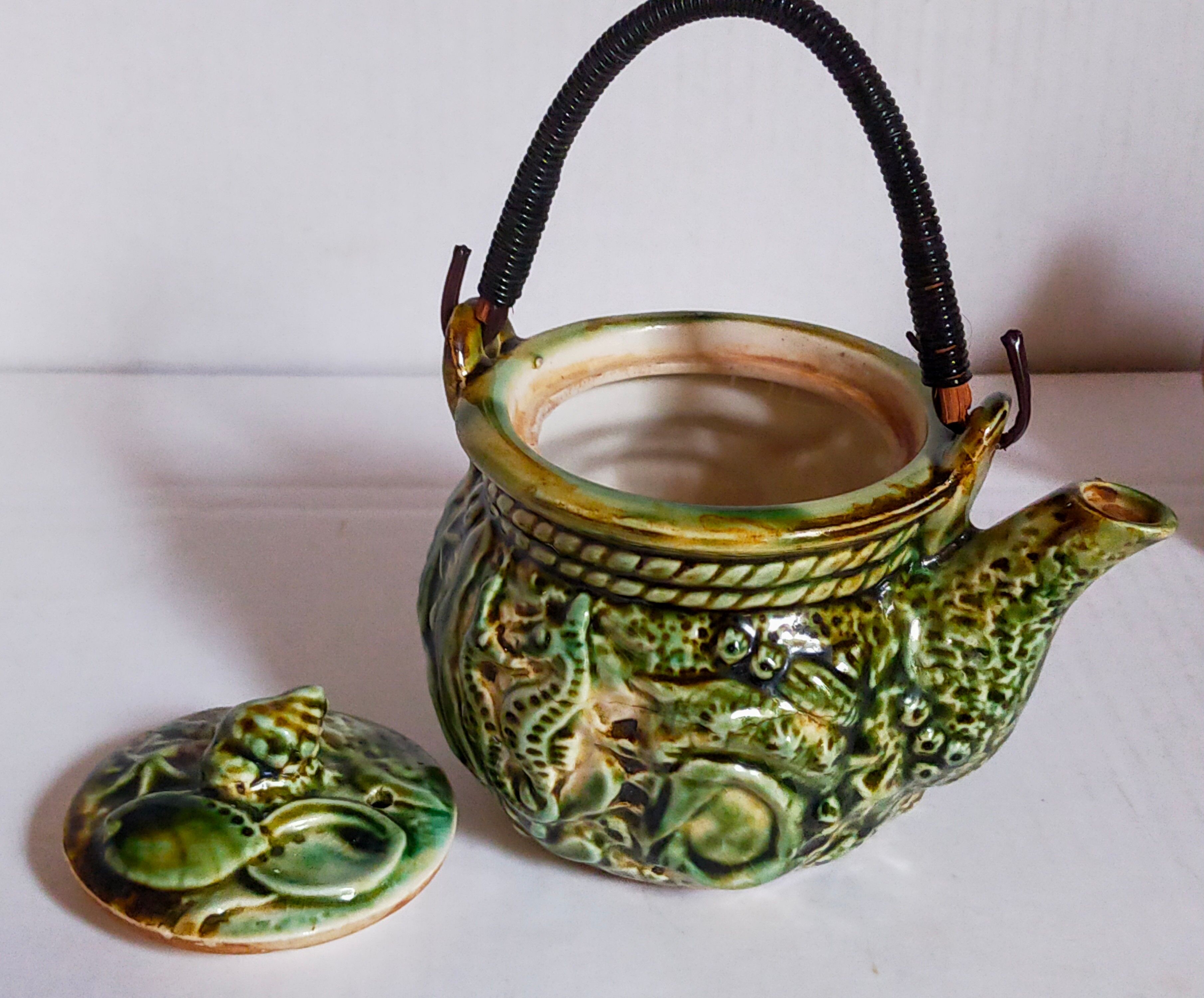 Set of old teapots and honey pot