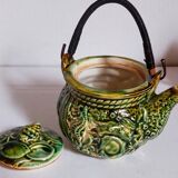 Set of old teapots and honey pot
