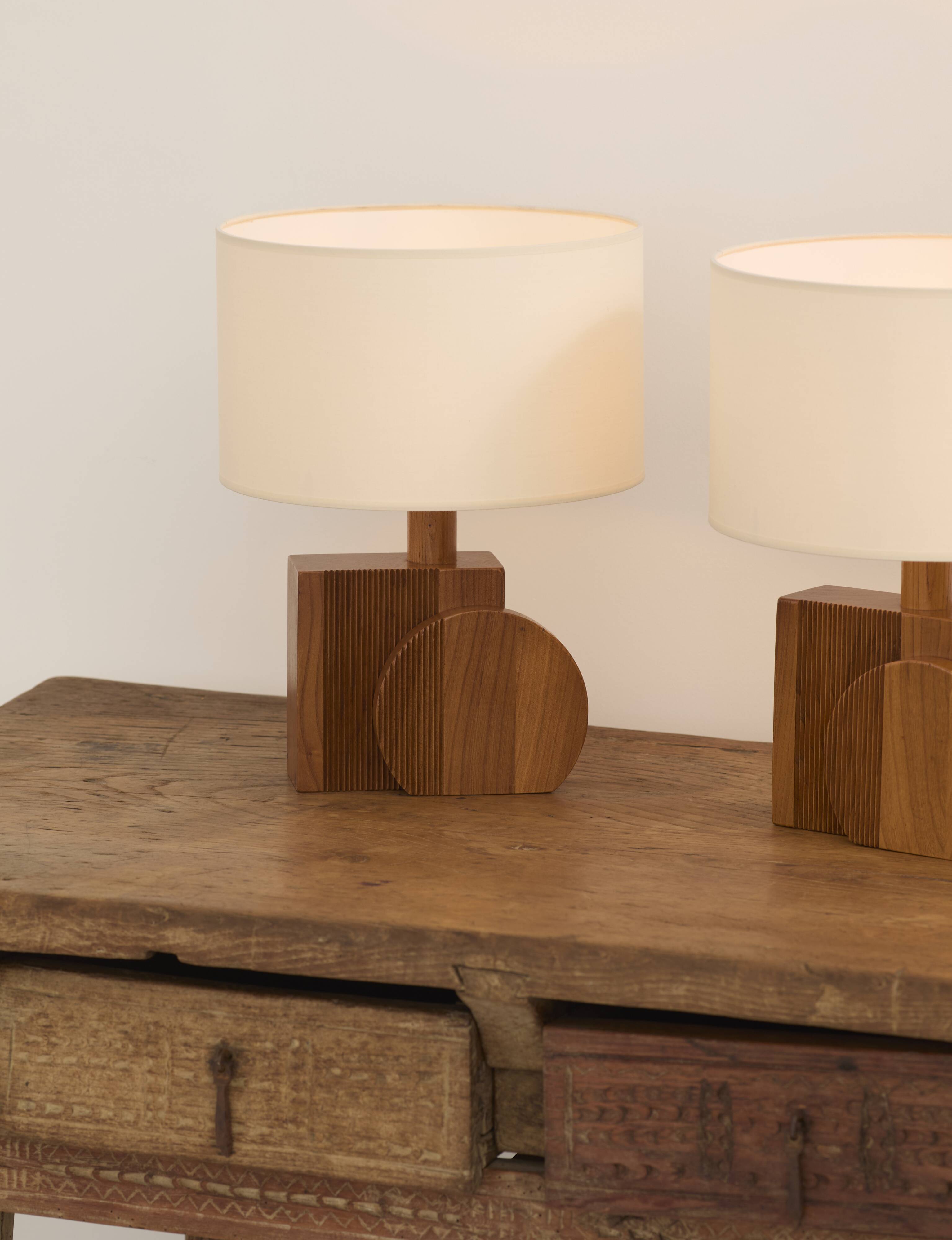 Pair of geometric handcrafted lamps in solid oak circa 1970.
