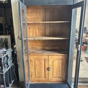 Black painted wardrobe with two glass doors and an interior sideboard.