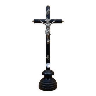 Black crucifix on foot