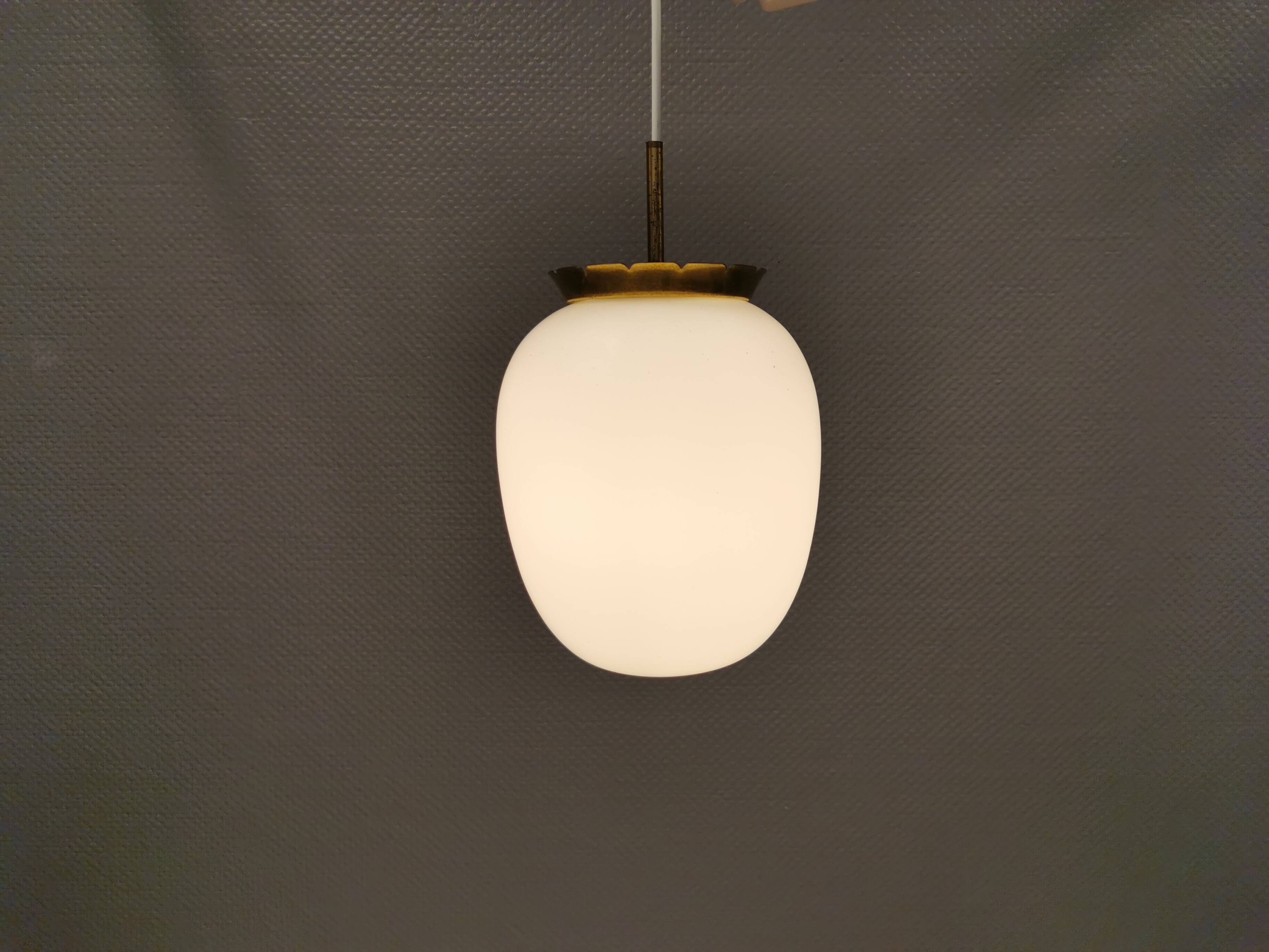 Old hanging lamp in milky white opal glass and brass top/suspension. Danish design 1930s