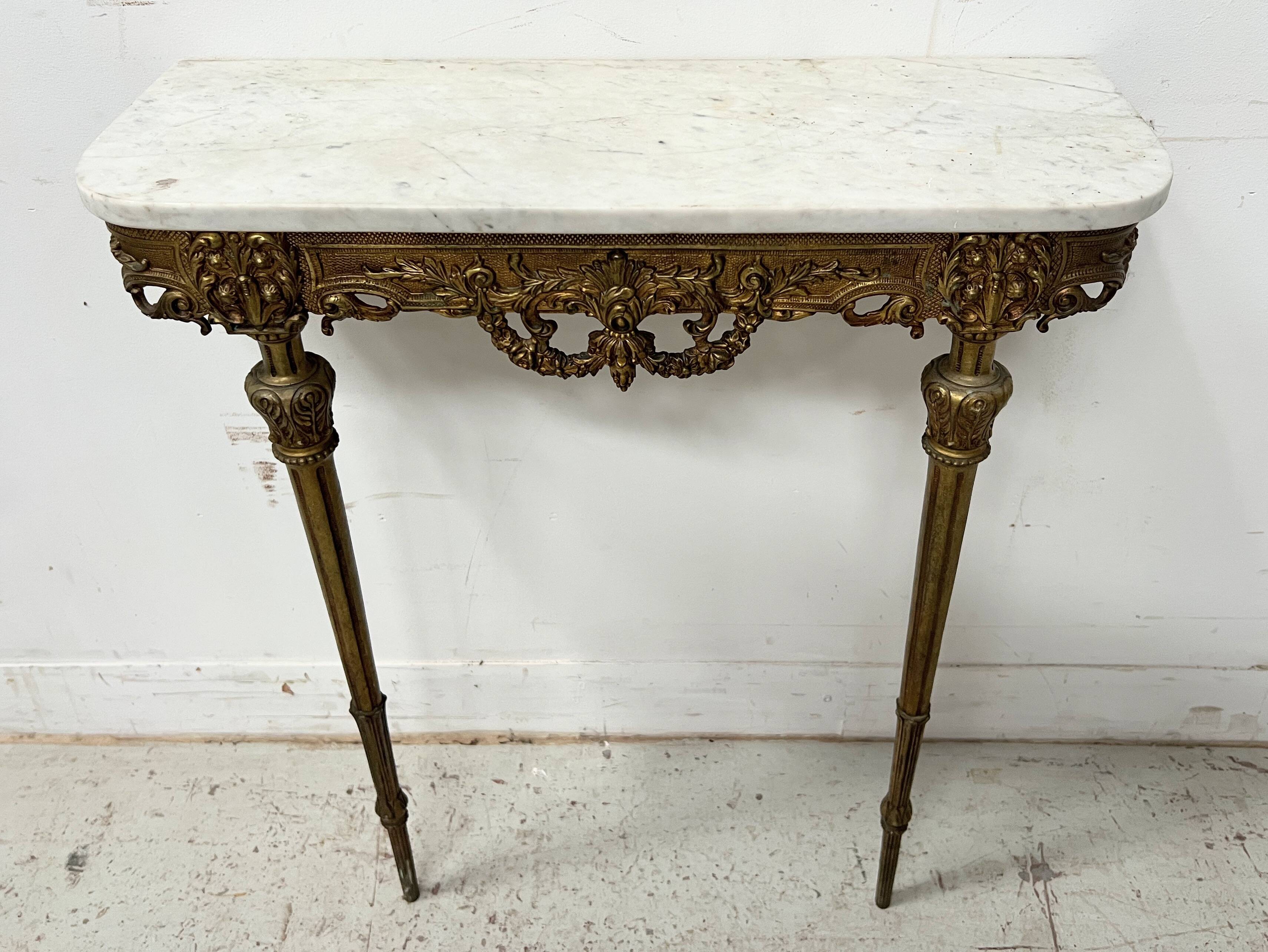 Louis XVI style console in chiselled bronze, 20th century.