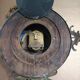 Wall clock in glazed earthenware decoration and brass chain empire style
