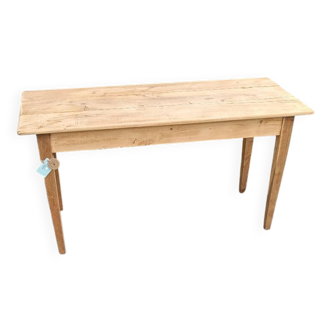 Large handcrafted table in raw wood