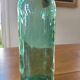 Vintage glass bottle l'Idéale with porcelain stopper