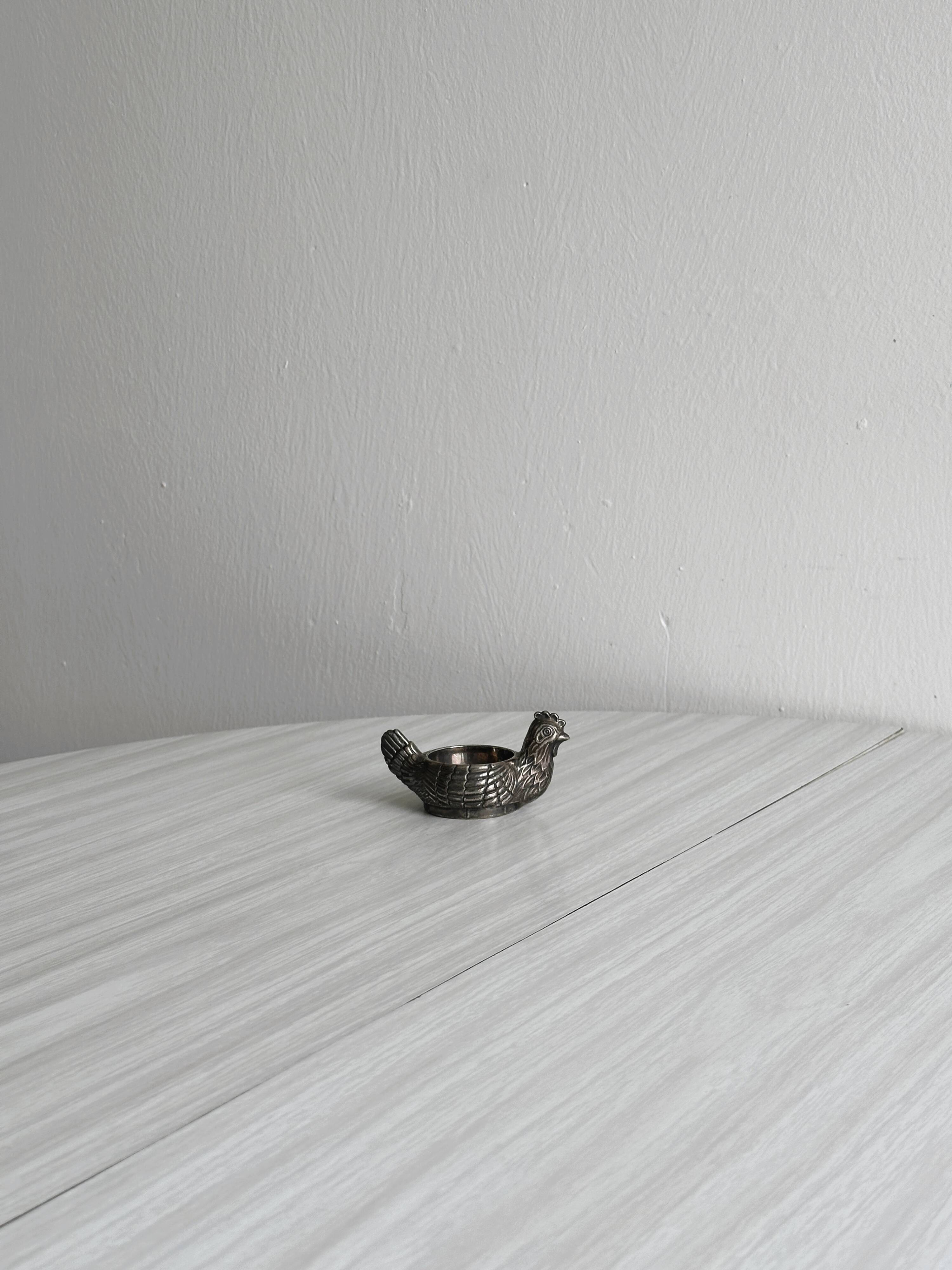 Antique egg cup in the shape of a hen