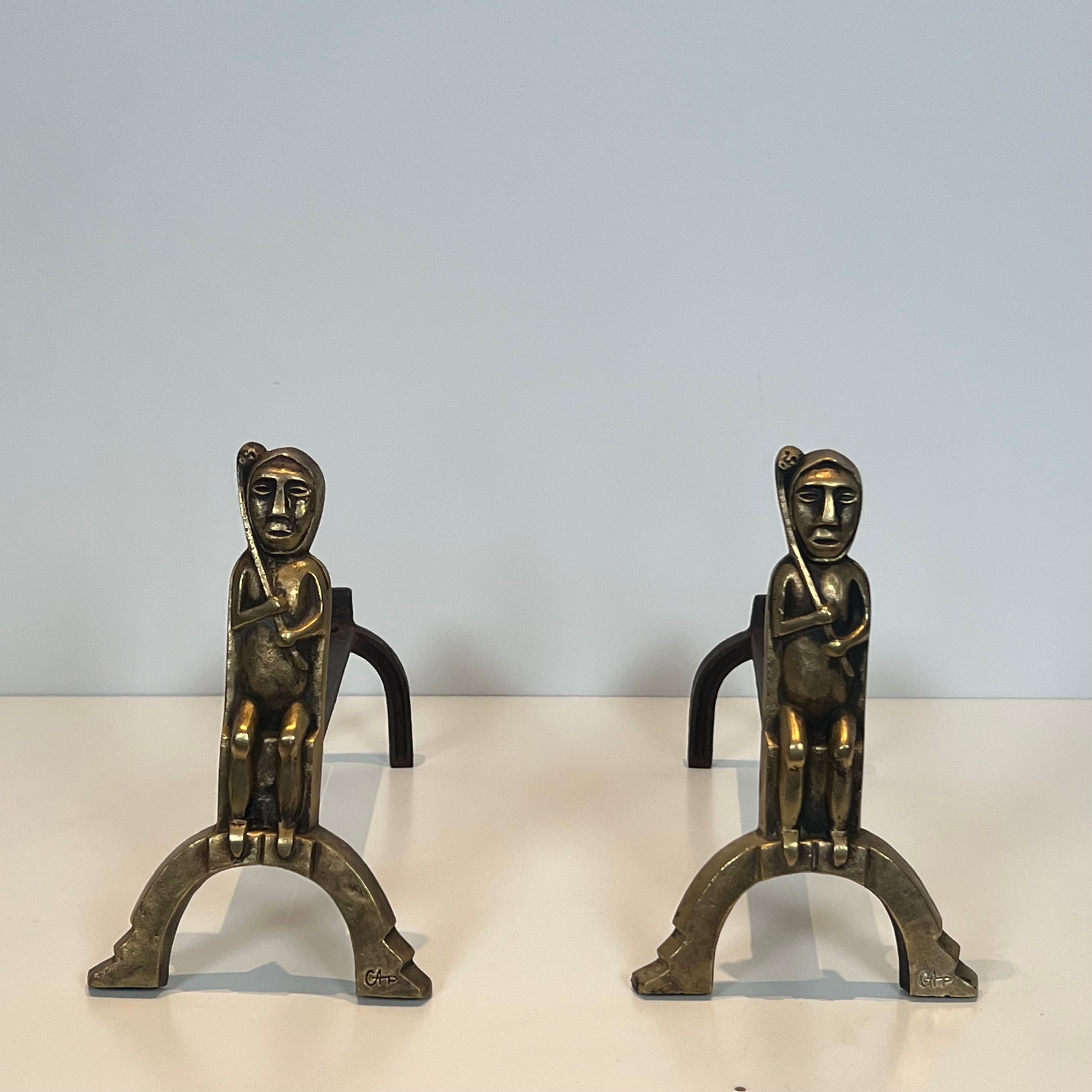 Pair of bronze andirons with seated shamans monogrammed Anton Prinner