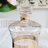 Blown glass decanter with golden borders