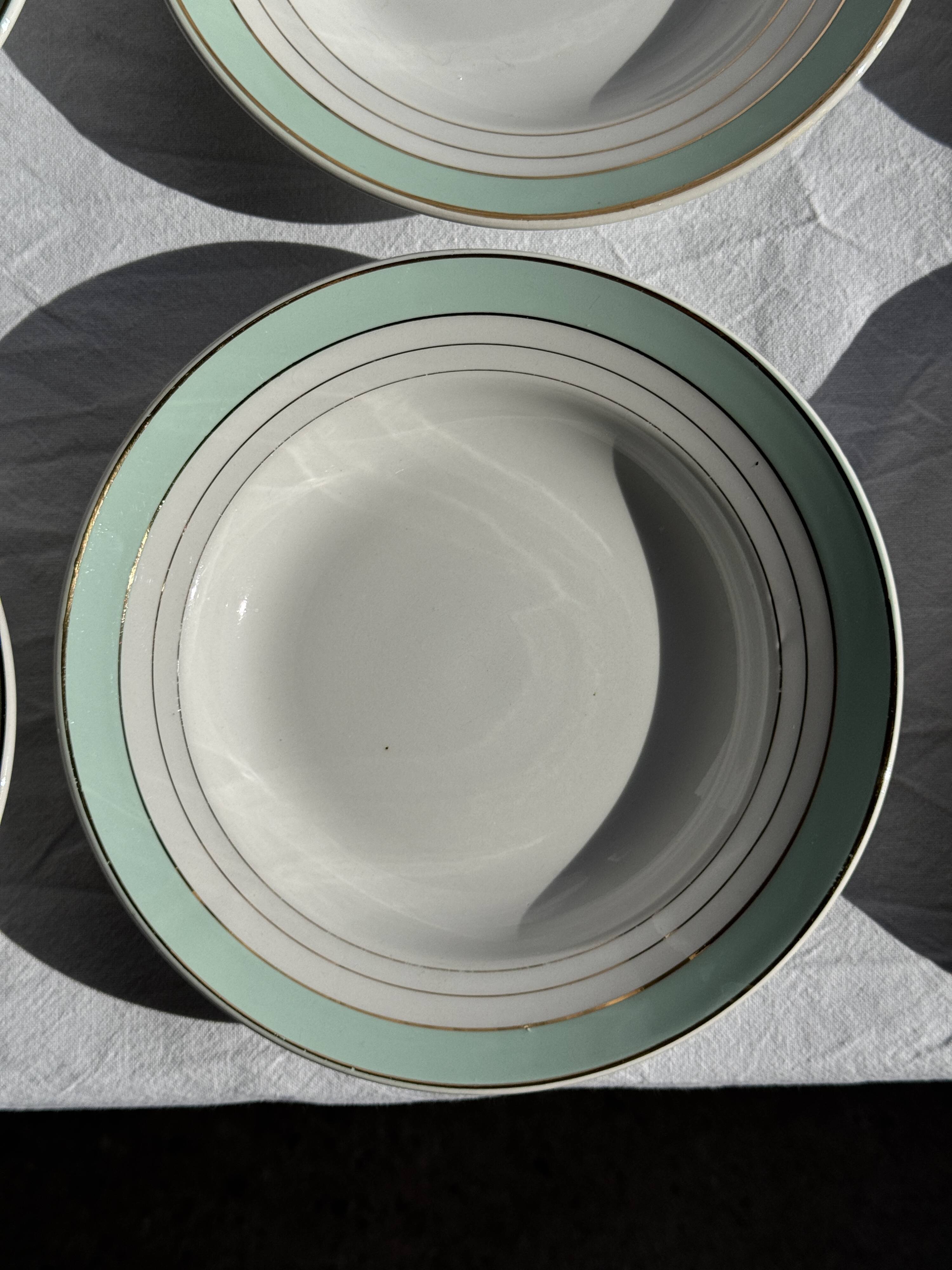 Set of 8 antique turquoise deep plates with a gold rim D22.5