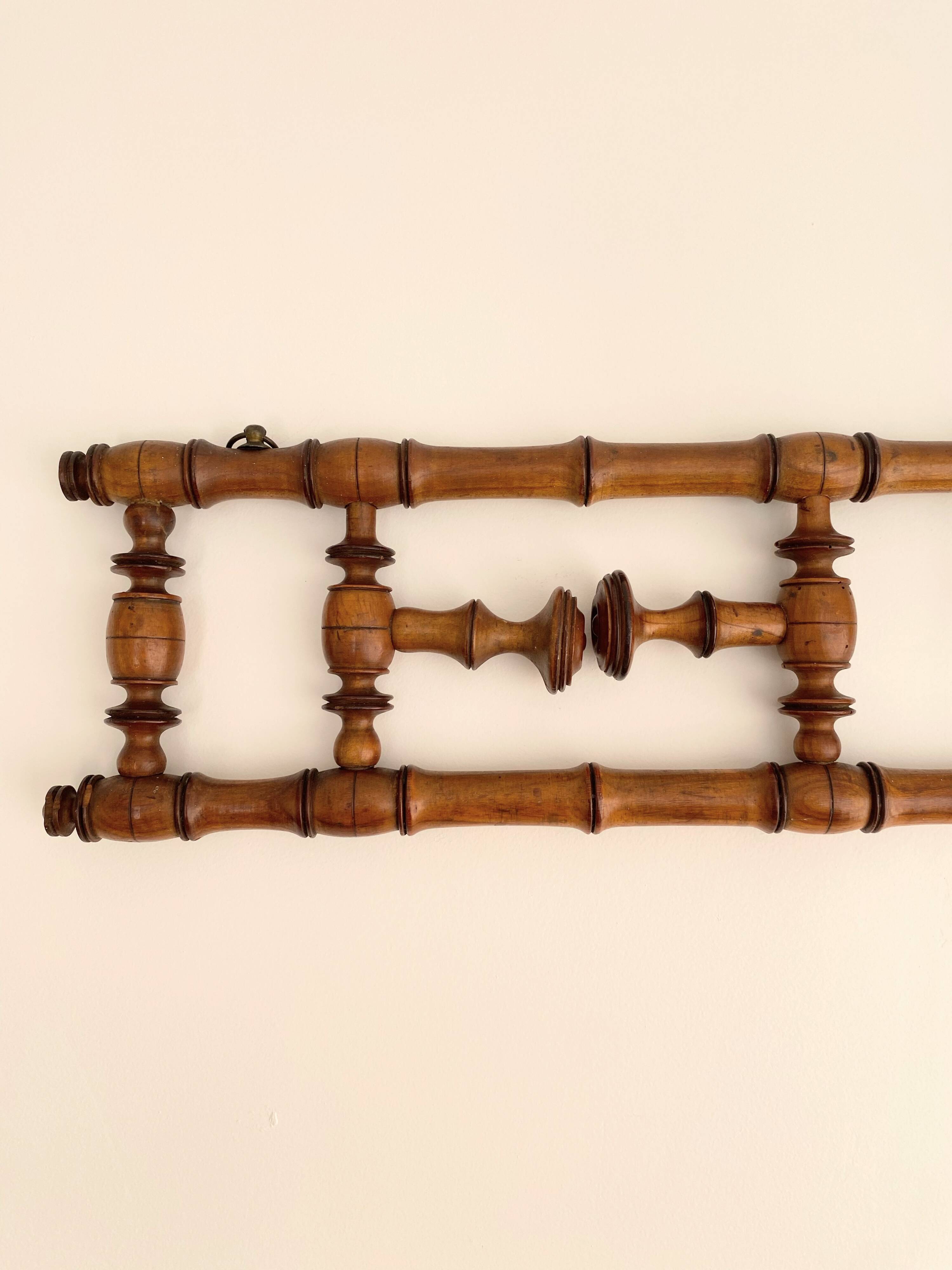 Vintage wooden wall coat rack with 4 swivel hooks from 1920