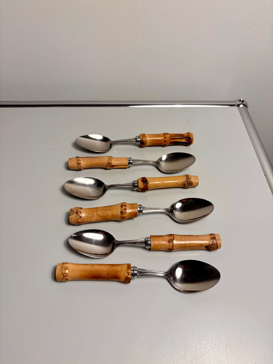 Set of 6 vintage dessert spoons with bamboo handles.