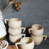 Six vintage potter's ceramic cups with vanilla enamel