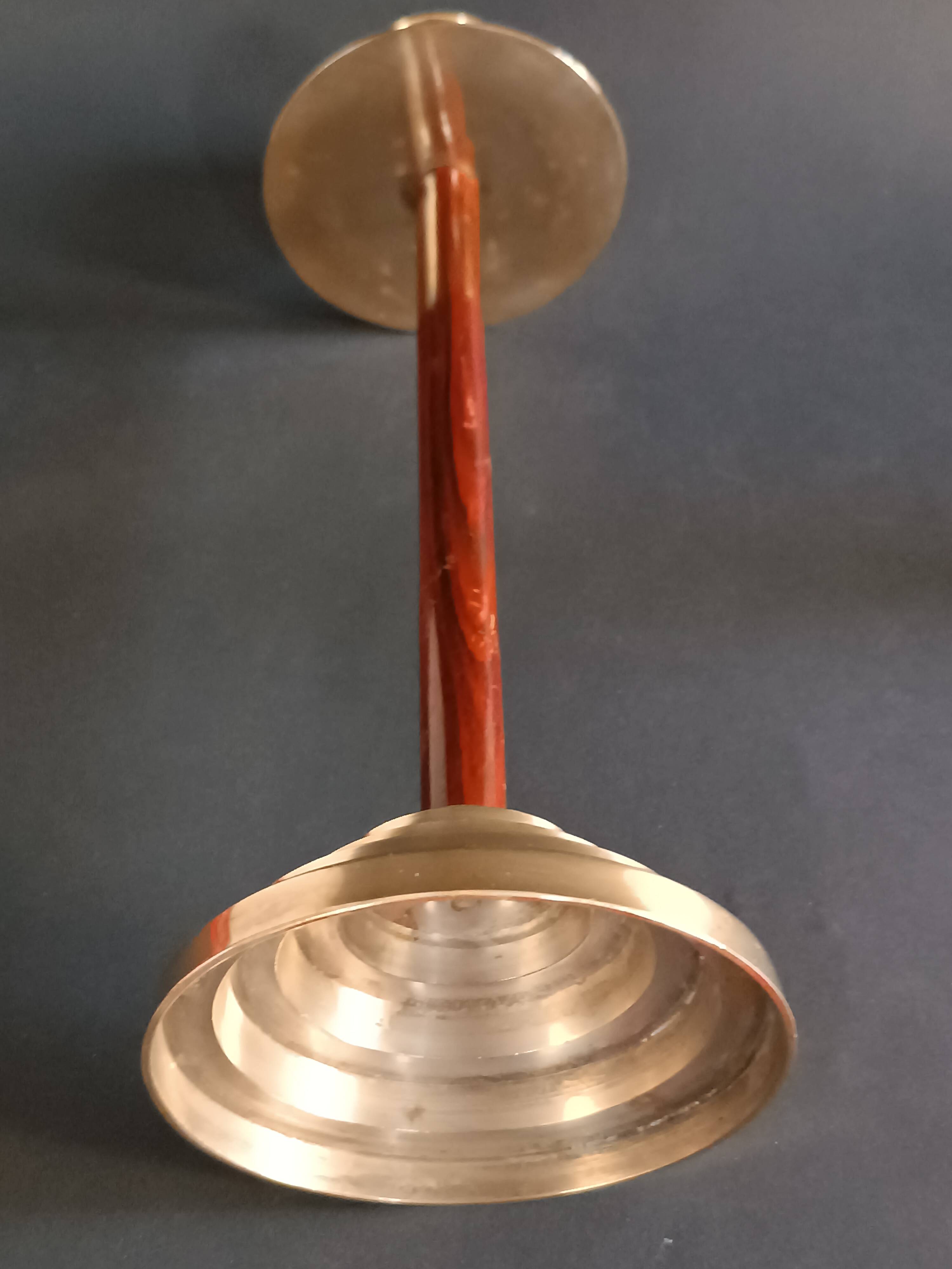 Two vintage wooden and brass candlesticks.