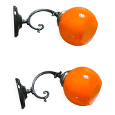Pair of wall sconces with orange opaline globes and porcelain rose.