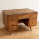 Vintage Scandinavian desk in waxed wood with 7 drawers.