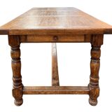 Large farmhouse table made of solid wood.