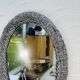 Vintage oval wicker mirror from the 1960s.