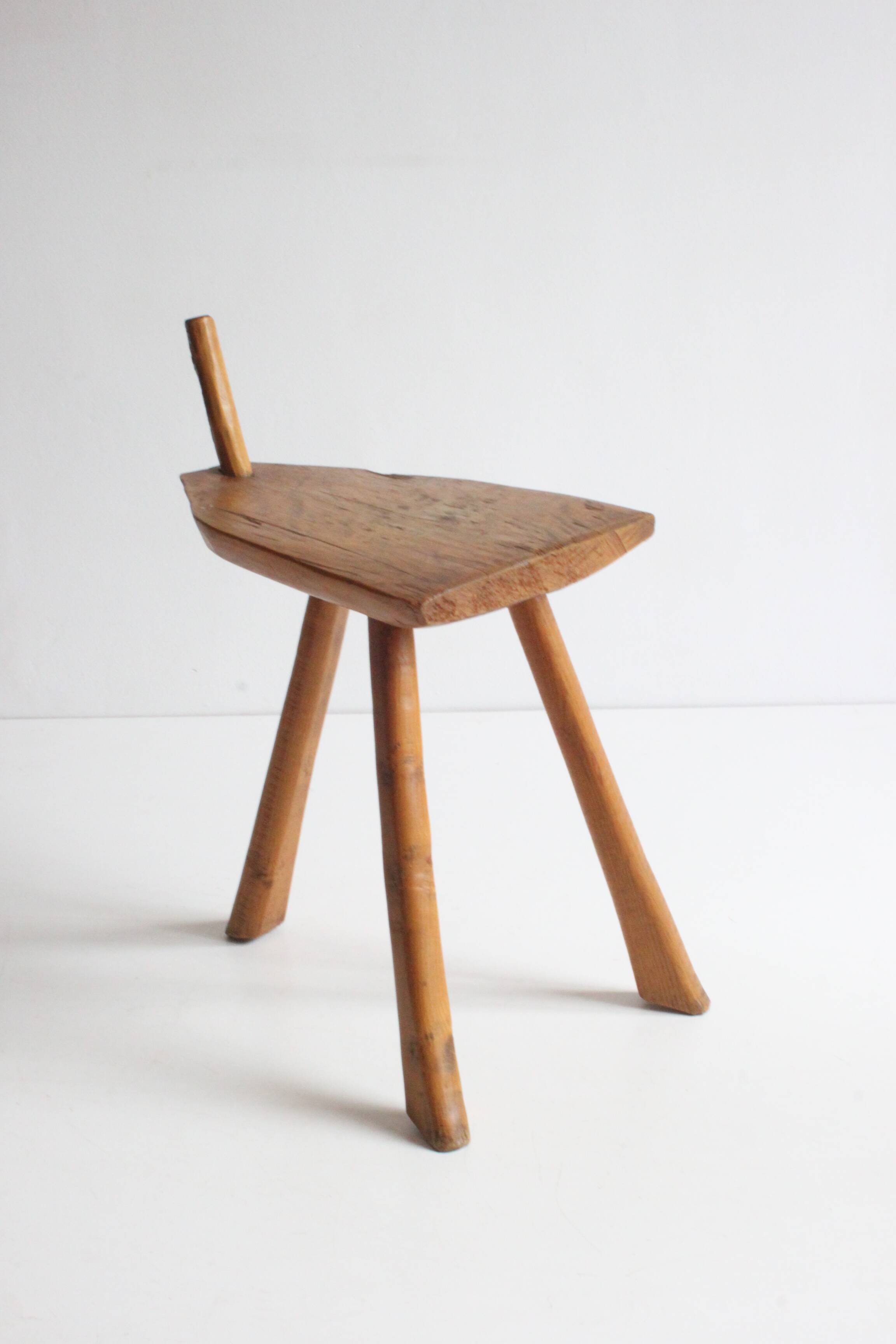Brutalist tripod stool in carved wood, 1950s